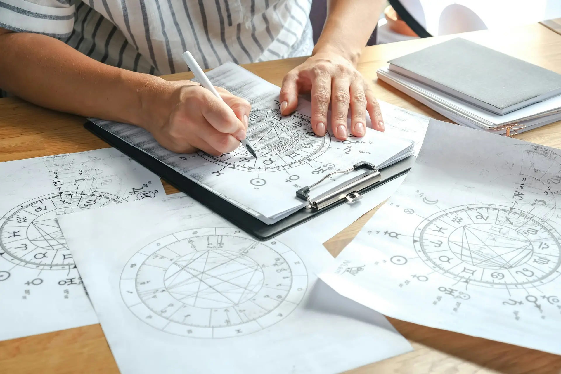 Astrology. Astrologer calculates a natal chart and makes a forecast of fate